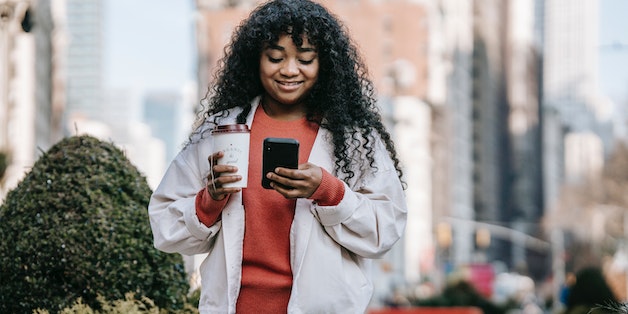 woman-smiling-at-phone